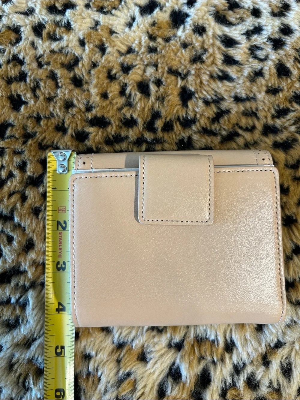 kate spade cream perforated leather bifold wallet